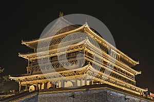 Illuminated ancient Drum Tower at the ancient city wall by night time, Xian, Shanxi Province, China