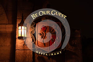 Illuminated Be Our Guest restaurant sign at Magic Kingdom 206