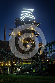 Illuminated Bolt Tower and the blast furnace after dark in Vitkovice in Ostrava, Czech Republic