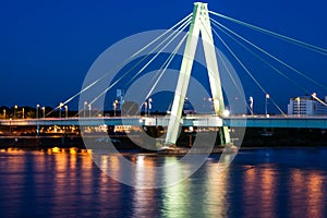 Illuminated bridge accross the river Rhein in Cologne