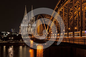Illuminated bridge in Cologne at night