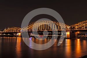 Illuminated bridge in Cologne at night