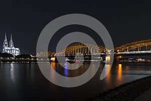 Illuminated bridge in Cologne at night
