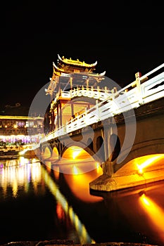 Illuminated bridge at fenghuang ancient town