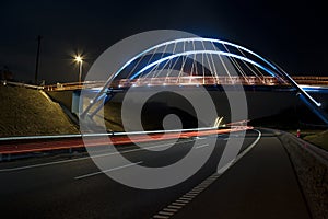 Illuminated bridge at night