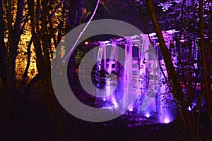 Illuminated Bridge and Waterfall