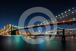 Illuminated Brooklyn Bridge by night