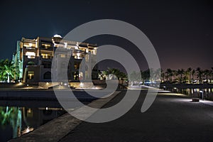 Illuminated building overlooking the ocean