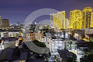 Illuminated buildings of the Makati district,after sunset at dusk,Manila,The Philippines