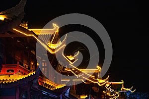 Illuminated buildings' rooftops of the Impression Water street in Meishan city, China