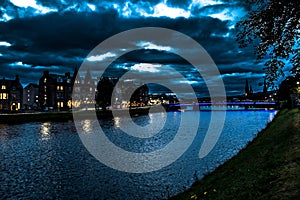 Illuminated Buildings In The Scenic Streets Of The City Of Inverness At The River Ness At Night in Scotland