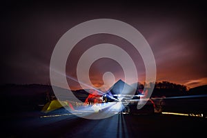 Illuminated camping tents at night in alpin zone