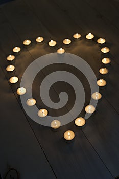 Illuminated Candles Placed In A Heart Shape