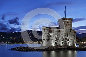 Illuminated castle by the sea in Rapallo