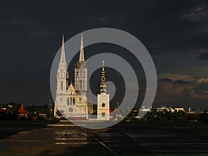 Illuminated cathedral in Zagreb over dark background