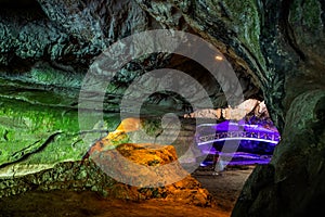 illuminated cave in Romania pestera bolii
