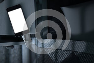 Illuminated Cellphone Next To Bed