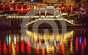 Illuminated Chinese Gate Grand Canal NIght Reflection Hangzhou Zhejiang China
