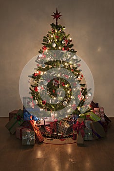 Illuminated christmas tree with presents