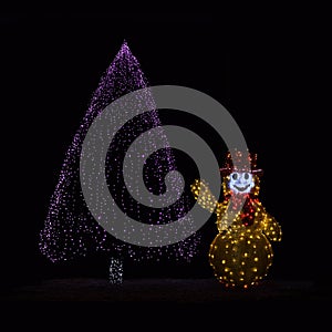 Illuminated Christmas tree and Snowman