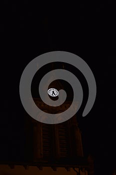church tower clock at night