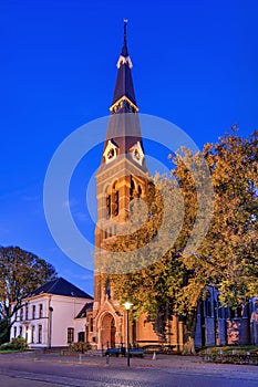 Illuminated church at twilight, Riel, netherlands