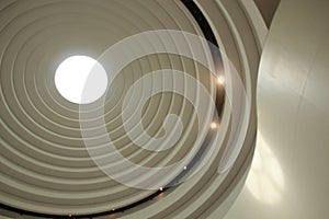 Illuminated circular skylight seen from below, concentric circles