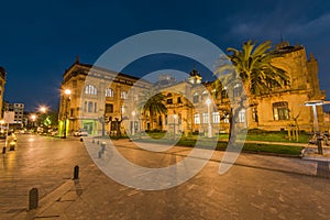 Illuminated City Hall in San Sebastian at twilight