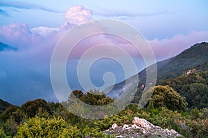 Illuminated cloudscape at mountain scenario photo