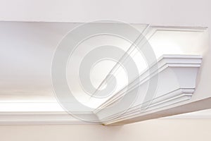 Illuminated cornice, bright interior background