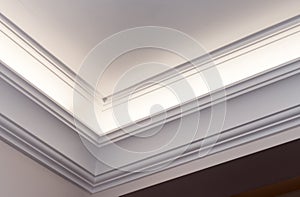 Illuminated cornice, bright interior background