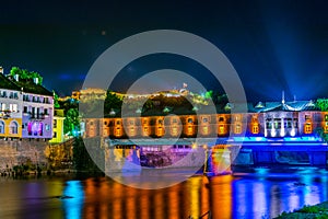 illuminated covered bridge reflecting on Osam river in the bulgarian city Lovech...IMAGE
