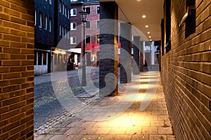 Illuminated and covered walkway in the city centre of Dusseldorf at night