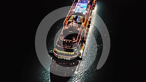 illuminated cruise ship in sea at night