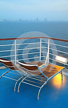 Illuminated deck-chair on ship deck