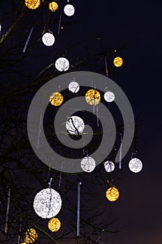 Illuminated decorations on a bare tree in Tallinn