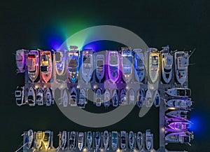 Illuminated docked boats at dusk