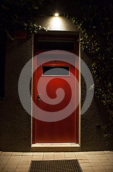 Illuminated door at night