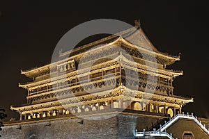 Illuminated Drum Tower at ancient city wall by night time, Xian, Shanxi Province, China