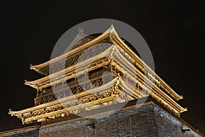 Illuminated Drum Tower at the ancient city wall at night, Xian, Shanxi Province, China