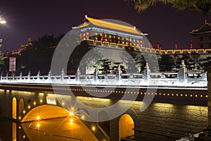 Illuminated famous ancient Bell Tower at night. China, Xian