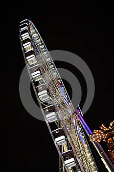 Illuminated ferris wheel at a funfair