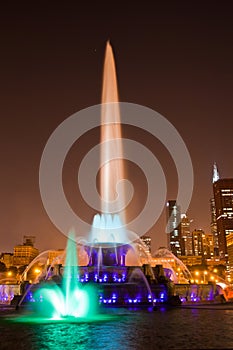 Illuminated Fountain against Chicago Skyline at Night