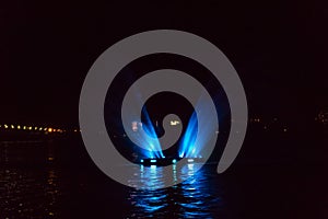 Illuminated fountain on the Dnieper river in Dnipro city, Ukraine