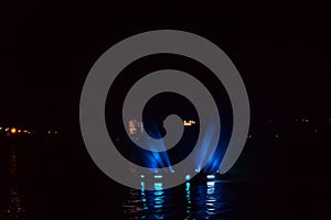 Illuminated fountain on the Dnieper river in Dnipro city, Ukraine