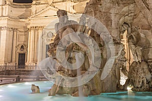 Illuminated Fountain of the Four Rivers in Rome in the night