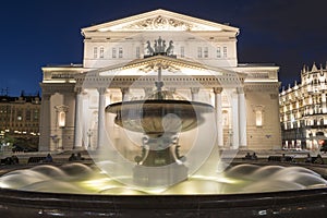 illuminated fountain and Great Moscow theater at nig