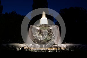 Illuminated fountain by night