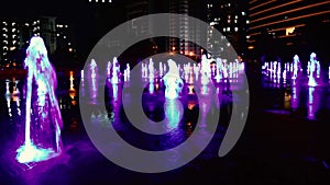 Illuminated fountain in the night park. Improvement of the territory.