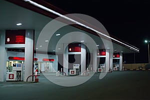 Illuminated gas station at night